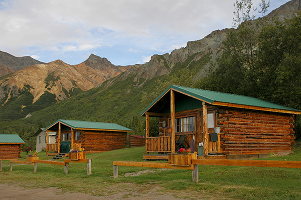 lodge cabins with mountain background